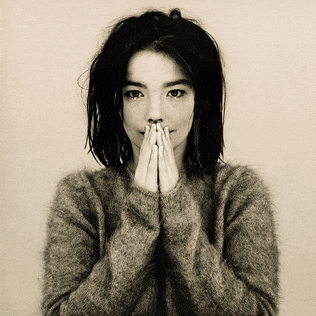 a black and white photo of a woman with her hands folded