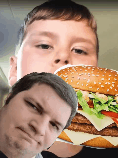 a boy holding a hamburger next to a man 's face