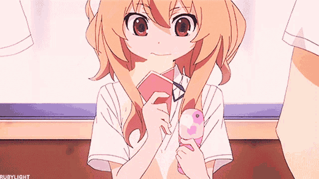 a girl in a white shirt is holding a pink item with the word rubylight on the bottom