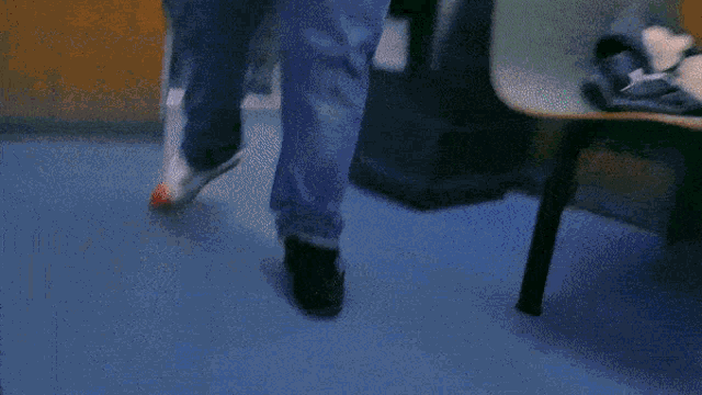 a blurry picture of a person 's legs and feet