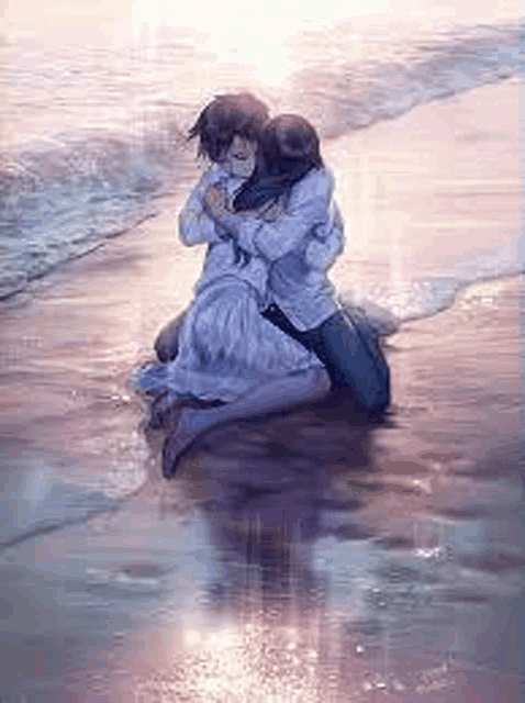 a man and a woman are hugging each other on a beach .