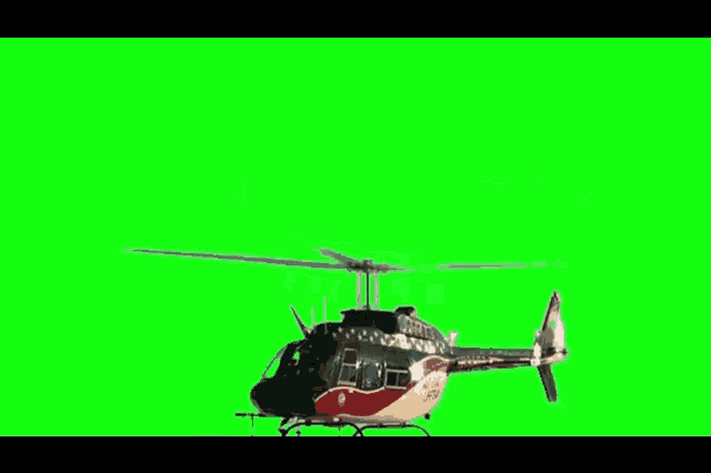 a police helicopter is flying in the air on a green background