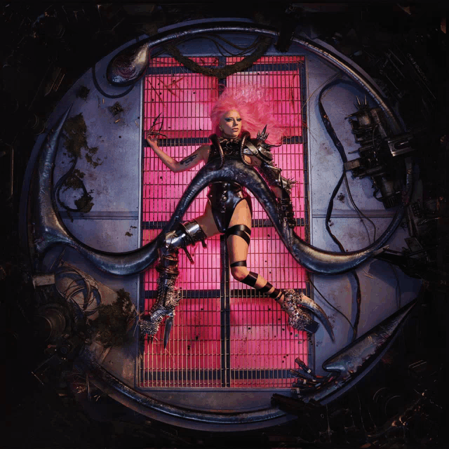 a woman with pink hair is laying on a circular platform