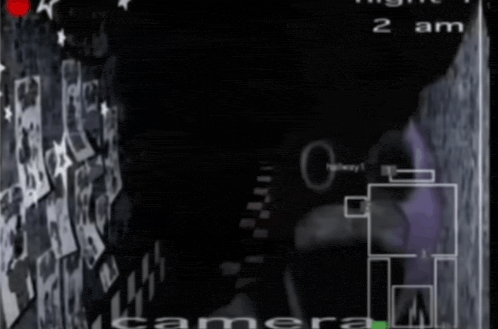 a black and white image of a camera with the time of 2 am on it