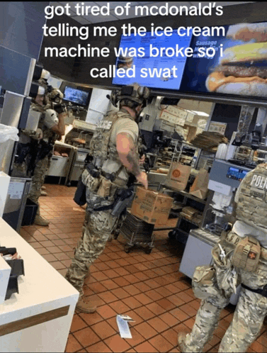 a man in a military uniform is standing in a mcdonald 's restaurant