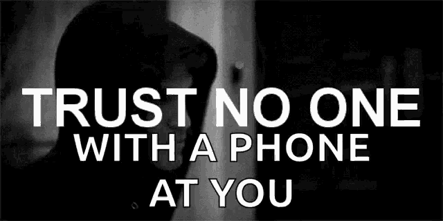 a black and white photo of a man with the words " trust no one with a phone at you " above him