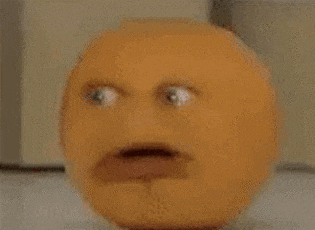 a close up of an orange with a face on it .