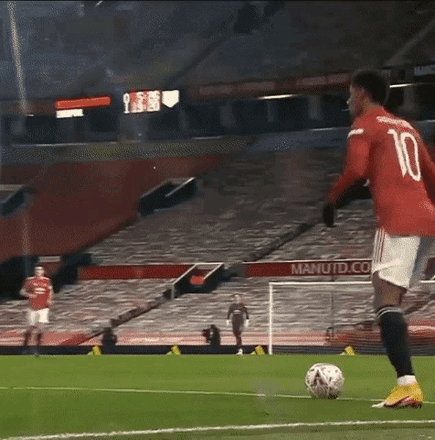 a soccer player wearing a red jersey with the number 10 on it