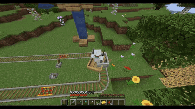 a screenshot of a minecraft game shows a cat on a wagon
