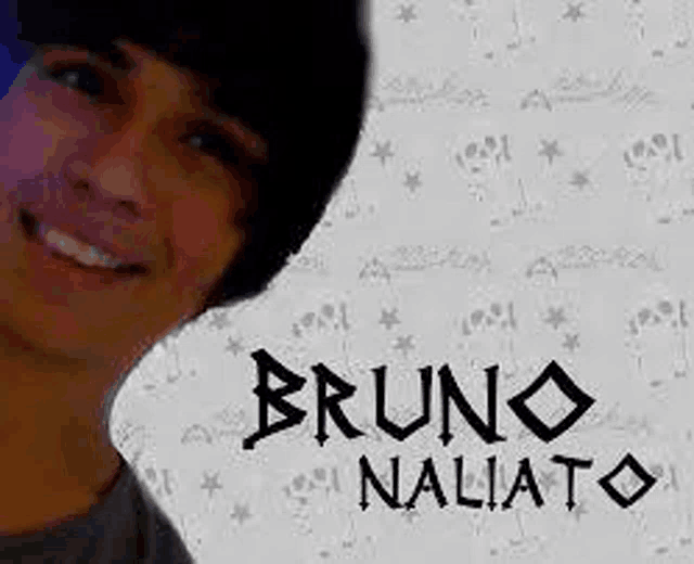 a young man is smiling in front of a white background with the name bruno naliato written on it .