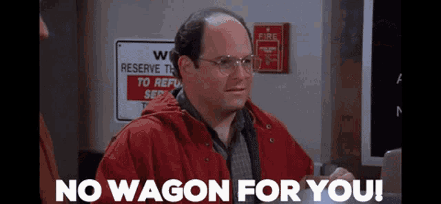 a man with glasses and a red jacket says no wagon for you