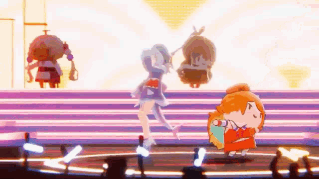 three anime characters are dancing on a stage in front of a crowd .