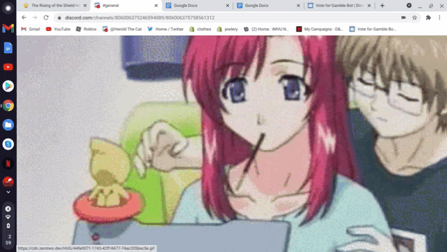 a computer screen shows a girl eating a pocky stick