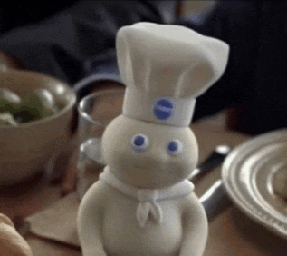 a pillsbury dough boy with a chef hat on