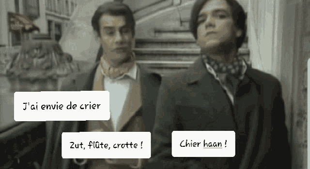 two men are standing next to each other and one of them is talking in french