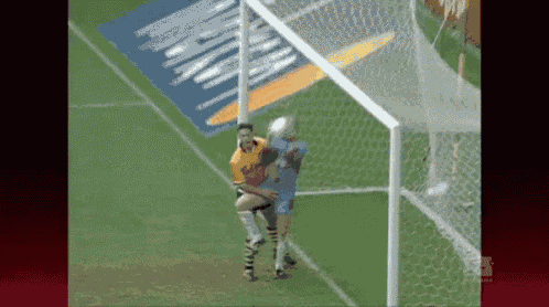 a soccer game is being played on a field with a sign that says ' allianz ' on it