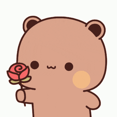 a brown teddy bear is holding a red rose in its hand