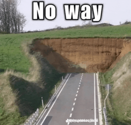 a road with a cliff on the side of it that says `` no way '' .