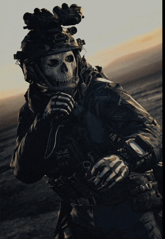 a soldier wearing a helmet with a skull on it holds a knife