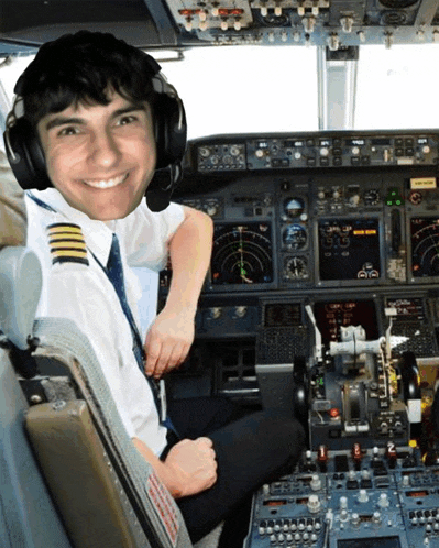 a smiling pilot is sitting in the cockpit of an airplane with a sign that says ' emergency exit ' on it