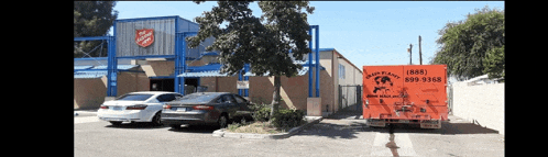 a truck with the number 1889 on the back is parked in front of a building
