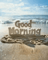 a sign on the beach that says `` good morning ''