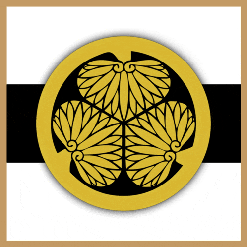 a gold and black circle with three flowers in the center