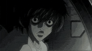 a black and white photo of a cartoon character with big eyes .