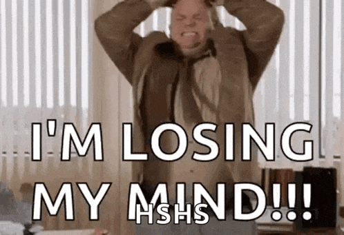 a man in a suit and tie is holding his head and screaming that he is losing his mind .
