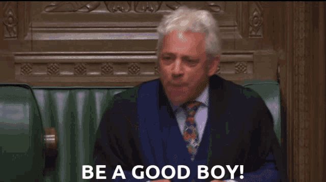 a large group of people sitting in a room with the words " be a good boy " on the bottom