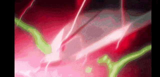 a close up of a pink and green light coming out of a hole in the ground .