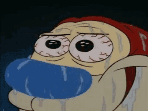 a close up of a cartoon character with a blue object in his mouth