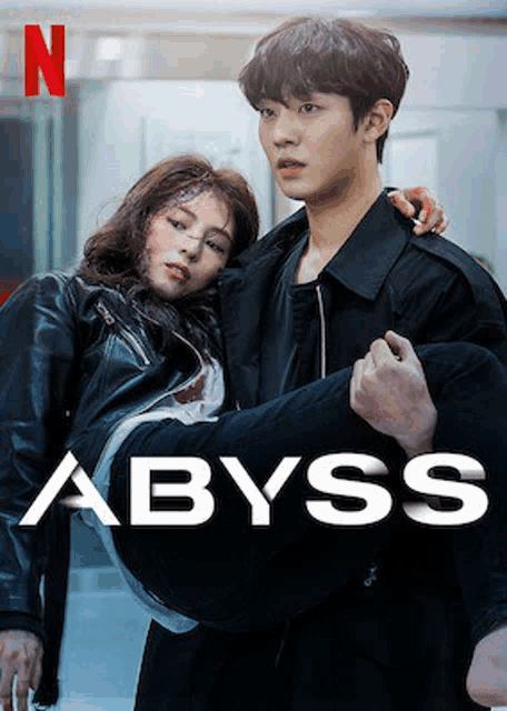 a man is carrying a woman in his arms in a movie poster for abyss .