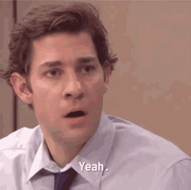 a man with a surprised look on his face says " yeah "