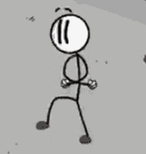 a stick figure is standing in front of a gray wall .
