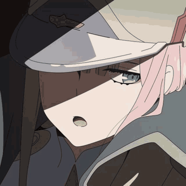 a close up of a girl wearing a hat and tie from darling in the franxx .