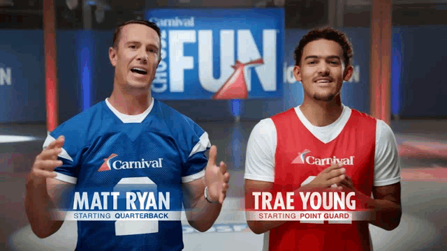 matt ryan and trae young stand next to each other in front of a carnival sign