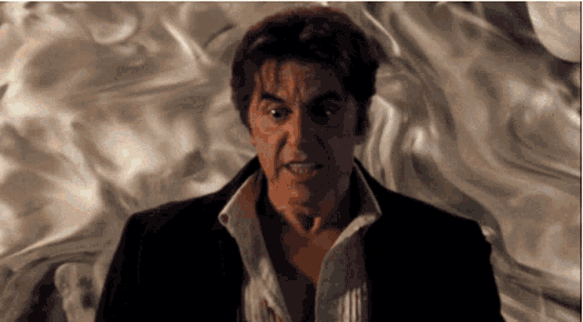 a close up of a man 's face with smoke coming out of it