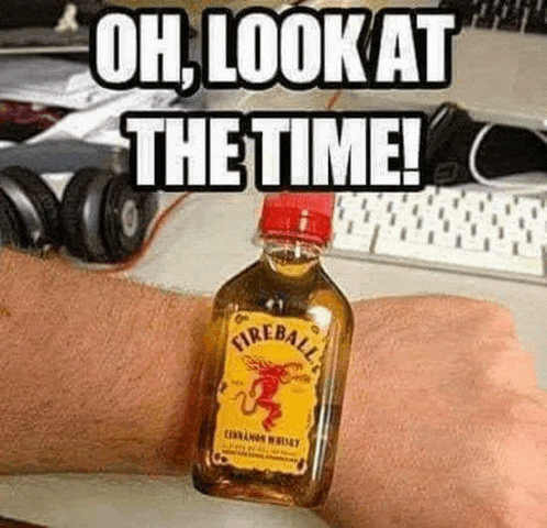 a person is wearing a watch with a bottle of fireball whiskey on it .