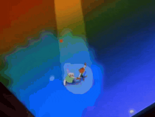 a couple of cartoon characters dancing on a stage .