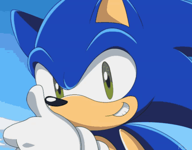 a close up of sonic the hedgehog giving the thumbs up sign