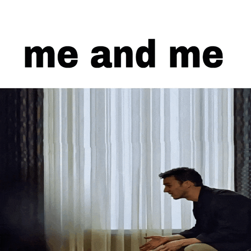 a man sits in front of a window with the words " me and me " above him