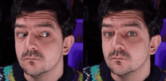 a man with a beard is making a funny face while wearing a sweater .