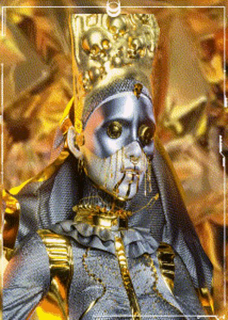 a statue of a woman with a gold crown