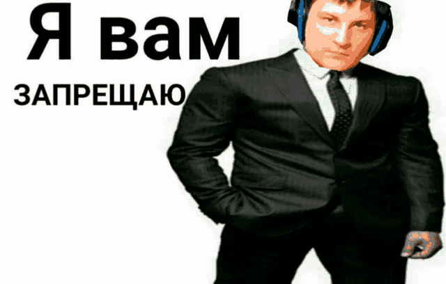 a man in a suit and tie wearing headphones stands in front of a white background that says " i bam "