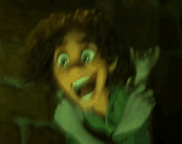 a blurry picture of a cartoon character making a funny face in the dark .