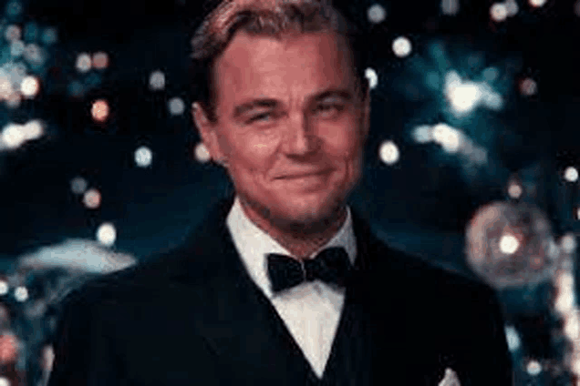 leonardo dicaprio is wearing a tuxedo and bow tie .