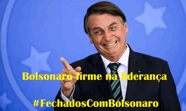 a man in a suit and tie is pointing at the camera with the words bolsonaro firme na lideranca behind him