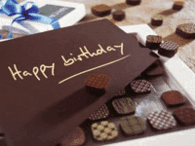 a box of chocolates with the words happy birthday written on the top