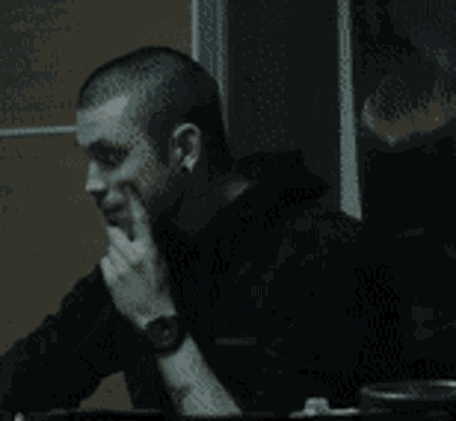 a man making a peace sign with his hand